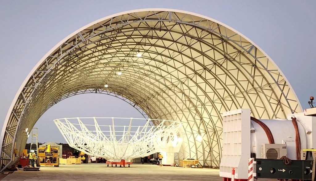 A reflector being assembled in the Antenna Integration Structure (AIS) at Site 1 in Australia. DARC, a trilateral partnership between the U.S., the UK and Australia, will provide three radar sites and 360-degree coverage of the GEO belt. Photo Credit: Mike Kortum, Four Sea Group Inc.