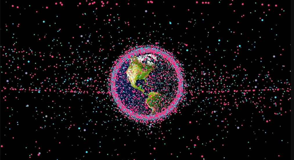 The U.S. Air Force tracks and publicly shares data on more than 19,000 orbiting objects. In this representation, satellites are shown in red, rocket bodies in blue, and other debris in gray. (Credit: James Yoder, Stuff in Space)