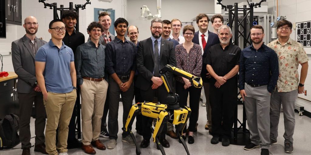 The Air Force Research Laboratory’s Digital Manufacturing Research Team celebrates the official opening of the new Collaborative Automation for Manufacturing Systems Laboratory at Wright-Patterson Air Force Base after a ribbon-cutting ceremony July 23, 2024. This is the team’s first internal laboratory. (U.S. Air Force photo / Sarah Perez)