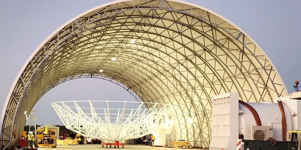A reflector being assembled in the Antenna Integration Structure (AIS) at Site 1 in Australia. DARC, a trilateral partnership between the U.S., the UK and Australia, will provide three radar sites and 360-degree coverage of the GEO belt. Photo Credit: Mike Kortum, Four Sea Group Inc.