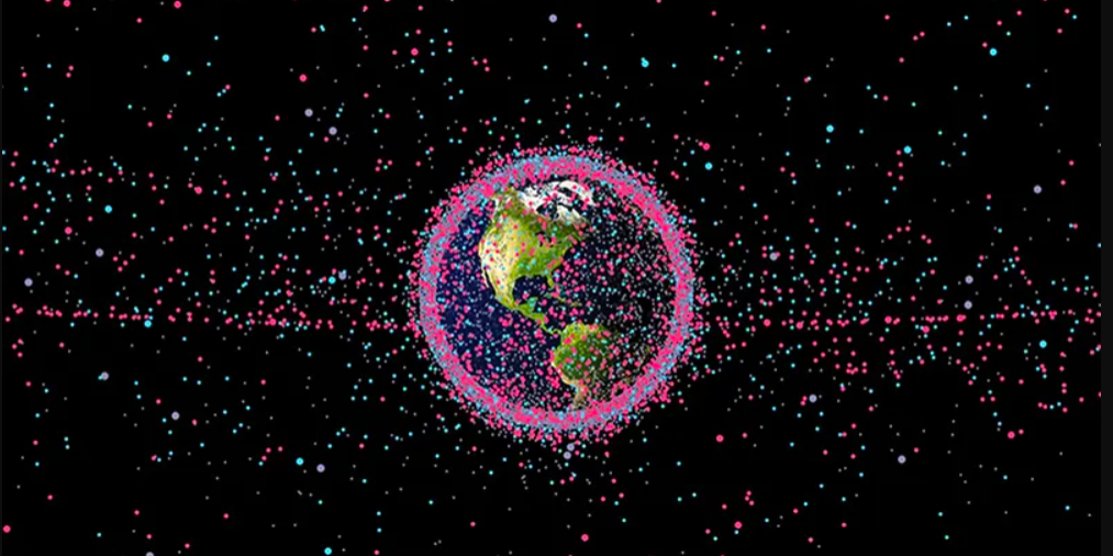 The U.S. Air Force tracks and publicly shares data on more than 19,000 orbiting objects. In this representation, satellites are shown in red, rocket bodies in blue, and other debris in gray. (Credit: James Yoder, Stuff in Space)
