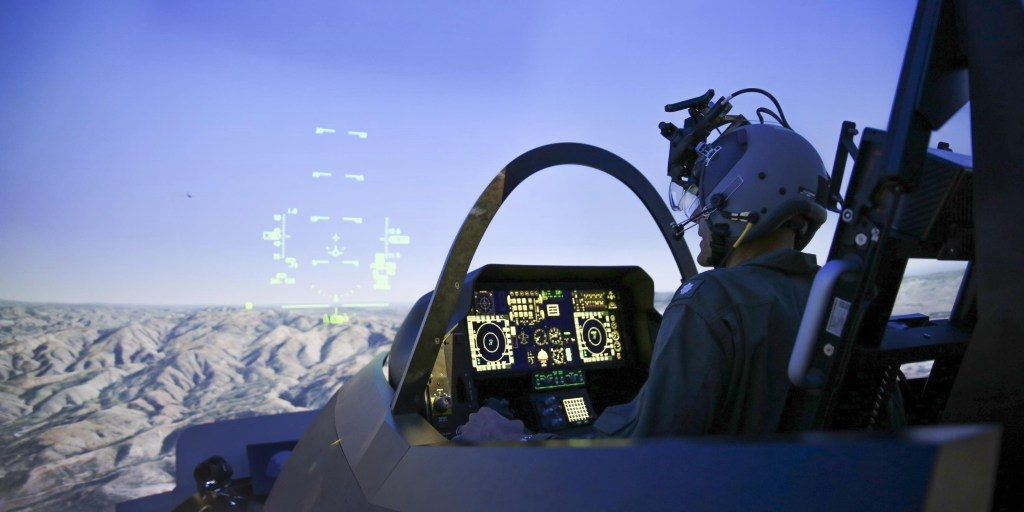 A pilot trains in the Joint Simulation Environment (JSE) at the Naval Air Warfare Center Aircraft Division in Patuxent River, Md. Tactical pilots from the Marine Corps and Air Force conducted the first-ever joint training exercise flying simulated combat missions together in F-35 and F-22 fifth-generation fighter jets in the JSE on March 24-27, 2024. (U.S. Navy photo by Terri Thomas)